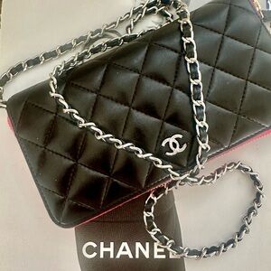 CHANEL Black Quilted Leather Crossbody with Red Trim